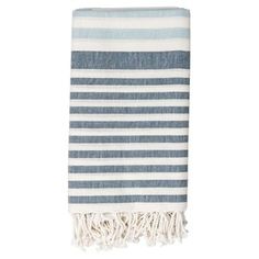 a blue and white striped towel with fringes