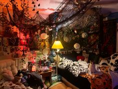 a bed room filled with lots of different types of decorations on the walls and ceiling