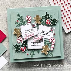 a christmas card with some candy canes and holly decorations on the front, along with other holiday cards