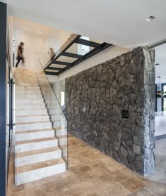 there is a stone wall and stairs in this house