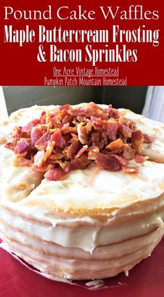 a cake with white frosting and bacon on top is sitting on a red plate