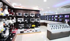 a store with many different types of microwaves on display