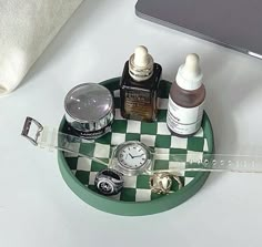 an assortment of beauty products sitting on a checkered tray