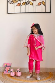 This pink kurta pyjama has been a dream come true for all the mums out there who have been wanting to get their babies dressed in ethnic yet comfortable wear.  Kurta pyjama only, no dupatta. Fabric- cotton Colour - Pink Sizes - 6months to 5years Approx measurements in inches- Photo attached. Care Guide - Dry clean only Disclaimer - pl check measurements before ordering as exchange and refunds based on measurements is not possible. Colours can vary due to screen settings. Model photography is don Long Sleeve Pink Kurta With Gota Work, Pink Long Sleeve Festive Set, Festive Pink Long Sleeve Sets, Pink Gota Work Kurta For Eid, Pink Kurta With Gota Work For Eid, Pink Pant Set For Festive Occasion, Pink Gota Work Sets For Diwali, Pink Sets With Gota Work For Navratri, Pink Gota Work Sets For Navratri