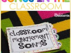 a close up of a sign on a blanket with the words classroom management songs below it