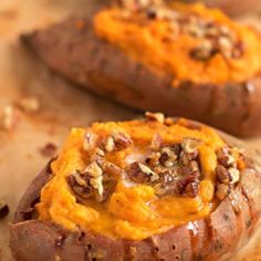 baked sweet potatoes topped with cheese and nuts