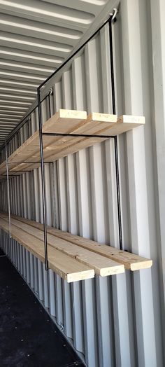 three shelves are attached to the side of a shipping container