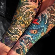 two people with tattoos on their arms and legs, both have dragon heads in them