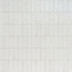 a white tiled wall with no one in it