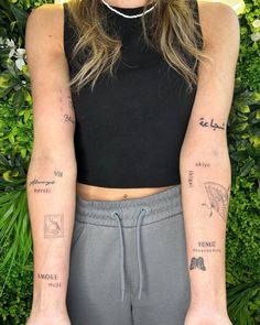 a woman with two tattoos on her arms