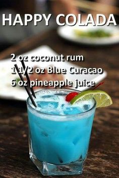 the happy colada cocktail is served in a blue curacao with a lime slice