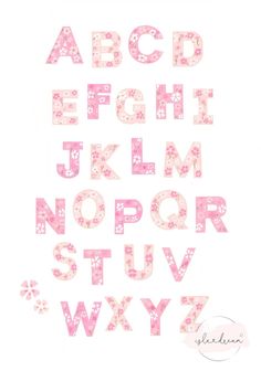 a pink and white alphabet with flowers on it