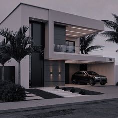 a car is parked in front of a modern house with palm trees on the side