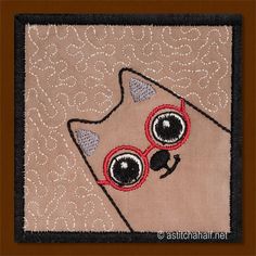 a close up of a piece of cloth with an animal on it's face