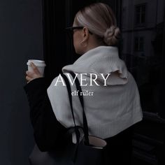 a woman holding a coffee cup in her right hand and the words avery on it