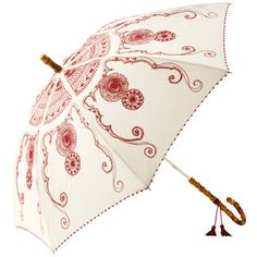 an umbrella with red and white designs on it