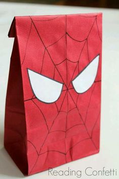 a paper bag with a spiderman face on it