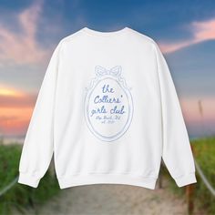 a white sweatshirt that says the cooter's girls club on it