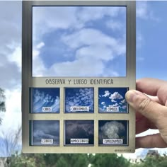 a hand holding up a business card with pictures of clouds in it and the words coserva y ligo identicala