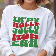 🩴 In My Mom Era Sweatshirt. Holly Jolly Mom Sweatshirt.  Celebrate the Holiday Season with this trendy and fun mama shirt.  Merry Christmas! 🩴 Gilden Brand Sweatshirt - This unisex heavy blend crewneck sweatshirt is pure comfort. These garments are made from polyester and cotton. This combination helps designs come out looking fresh and beautiful. The collar is ribbed knit, so it retains its shape even after washing. There are no itchy side seams on these sweaters. 50% cotton, 50% polyester. M In My Mom Era, Retro Christmas Shirt, Mom Era, Christmas Crewneck, Holiday Shirt, Mom Sweatshirt, Branded Sweatshirts, Holiday Shirts, Holly Jolly