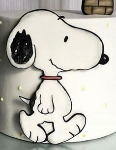 a white cake with a cartoon dog on it