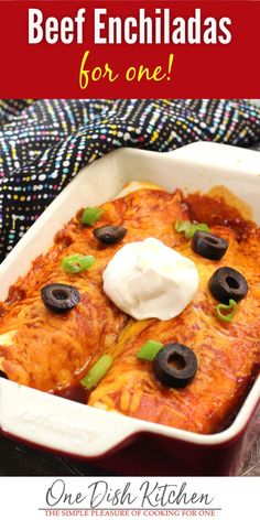 an enchiladas casserole with sour cream and olives in it