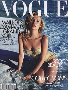 a magazine cover with a woman sitting in the water