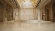 the inside of a building with marble floors and arches on either side of the wall