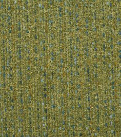 an upholstered fabric with blue and green speckles on the top half