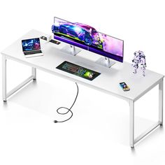 a computer desk with two monitors and a keyboard on it, all connected to a mouse pad