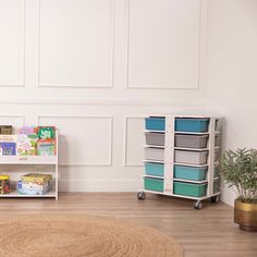 a child's playroom with toys, books and other items on the floor