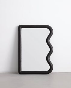 an abstract black frame on a white wall