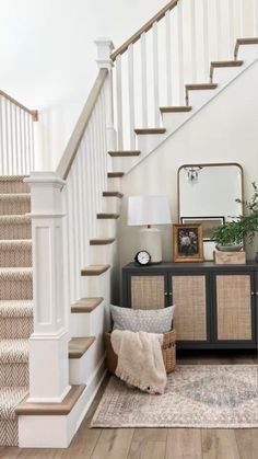 the stairs in this home are painted white and have wood treading on each side