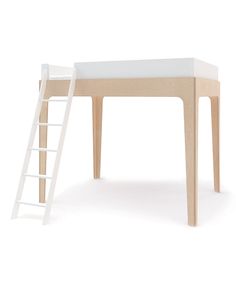 a white ladder sitting next to a wooden table with a bed on top of it