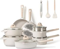 an assortment of pots and pans with utensils