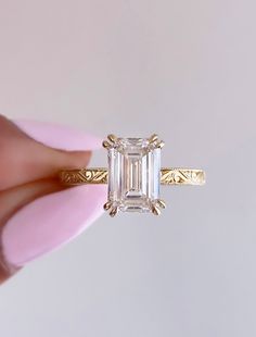 caption:Shown with 2ct emerald cut in 14k yellow gold Cushion Cut Engagement Ring Vintage, Wedding Rings Gold Emerald Cut, Rectangle Gold Band Engagement Rings, Royal Emerald Cut Diamond, Esmeralda Engagement Ring, Dainty Rectangle Engagement Ring, Antique Engagement Rings Art Deco, Ring Stack Emerald Cut, Platinum Bezel Engagement Ring