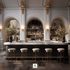 an elegant bar with stools and marble counter tops