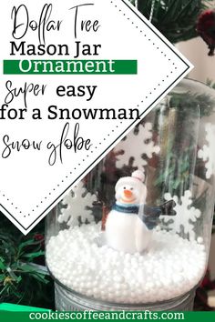 an ornament in a glass jar with snow inside and text overlay that reads dollar tree mason jar ornament super easy for a snowman