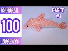 a pink dolphin made out of beads on top of a white background with the words, 100