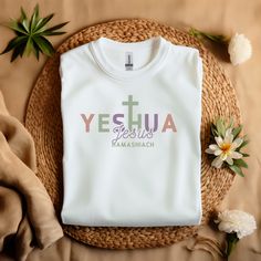 This comfy colorful Yeshua T-Shirt is perfect for showing your faith. It's great for kids and adults who love Jesus. Wear this aesthetic Christian tee to share your love for Him and spread His message with this religious and inspiring t-shirt. The classic fit ensures a comfy, relaxed wear while the crew neckline adds that neat, timeless look that can blend into any occasion, casual or semi-formal. Perfect for those who celebrate religious holidays or want to showcase their faith in everyday life Jesus Tshirt Design, New Year T Shirt Design, Catholic Clothing, Apparel Aesthetic, Beautiful Tshirts, Christian Shirts Designs, Aesthetic Christian, Love For Him, Cool Shirt Designs