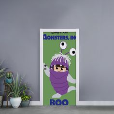 there is a door with an image of a monster on it and the words monsters, inc