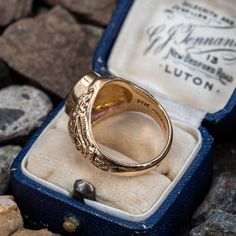 This vintage amethyst ring features scrolling work with latin phrases. The inside of the ring is inscibed "GLJ 64". The ring is currently a size 5.5 and we offer free resizing. The amethyst has a small chip partially hidden by the bezel. Antique 14k Gold Amethyst Ring, Antique 14k Stamped Amethyst Ring, Vintage Oval Gemstone Signet Ring, Antique Gold 14k Gold Amethyst Ring, Antique Gold Amethyst Ring In 14k Gold, Victorian Oval Engraved Ring, Heirloom Gold Sapphire Ring With Engraving, Vintage Oval Amethyst Ring In 14k Gold, Victorian Engraved Oval Ring