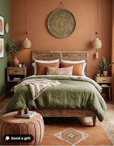 a bedroom with an orange wall, green bedding and wooden furniture in the corner