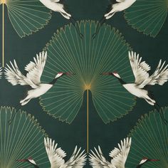 two white cranes are flying over green fan like designs on a wallpaper background with gold trim