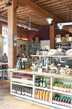 the inside of a bakery with lots of food