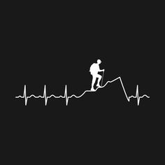 a man walking up the side of a mountain with heartbeat beat on it's wall