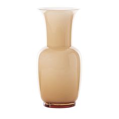 a beige vase sitting on top of a white table