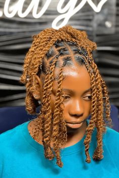 This charming hairstyle combines neatly woven cornrows at the front and lively, curly crochet twists cascading down the back, offering texture and fullness. The warm, honey-blonde hue of the crochet twists beautifully complements the wearer's complexion, adding a playful yet fashionable touch. Perfect for kids, - Click to see more of Fun and Creative Crochet Styles for Kids: 21 Ideas to Inspire Their Imagination and follow us for more hairstyle ideas. // Photo Credit: Instagram @hair_by_favy__ Cornrows With Weave