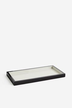 a black and white tray sitting on top of a table