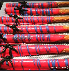 red, blue and black candy canes with sprinkles on them